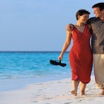 Couple Strolling on Beach ca. 2000 Maldives